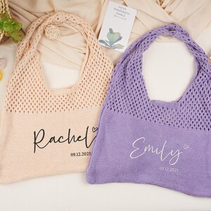 May include: Two knitted tote bags, one in peach and one in lavender, with an open weave design. The peach bag has the name "Rachel" and the date "09.12.2025" printed on it. The lavender bag has the name "Emily" and the date "09.12.2025" printed on it.