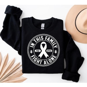 In This Family No One Fights Alone Sweatshirt Autism Awareness Breast Cancer Shirt Cancer Survivor Sweatshirt Cancer Support Shirt