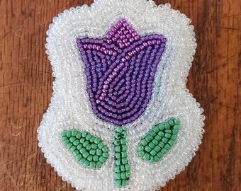 Porte-clés tulipe en cristal violet et blanc.