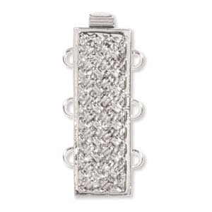 May include: A silver-colored, rectangular jewelry clasp with a textured, woven-like surface. The clasp has three loops on one side and a single loop on the other, designed for multiple strands. The top features a small, rectangular bar.