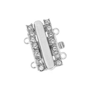 May include: A silver-toned jewelry clasp with three parallel bars. The outer bars are encrusted with small, clear crystals. The central bar is smooth and rectangular. The clasp has multiple loops for attaching to jewelry.