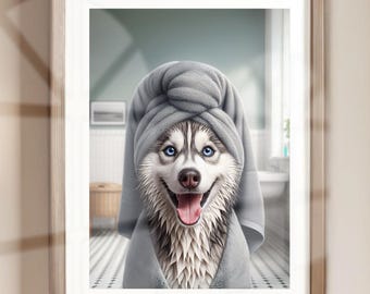 May include: A husky dog wearing a gray towel on its head and wrapped in a gray towel, looking at the camera with a happy expression. The dog is in a bathroom setting with white tiles and a white bathtub.