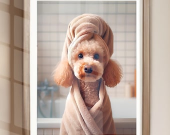 May include: A small, light brown poodle wearing a tan towel wrapped around its head and body, looking directly at the camera. The dog is in a bathroom setting.
