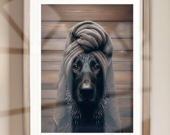 May include: A black dog with a wet, dark brown towel wrapped around its head, looking directly at the camera. The dog is in front of a wooden background.