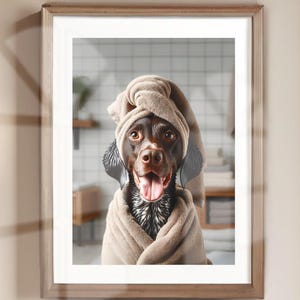 May include: A brown and white dog wearing a brown towel on its head and body. The dog is smiling and looking at the camera. The dog is in a bathroom setting with white tiles.