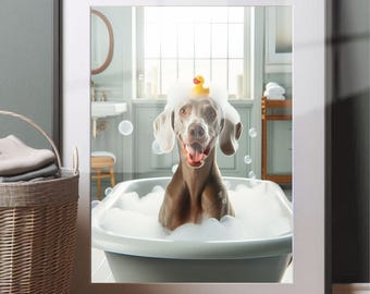 May include: A gray and white Weimaraner dog wearing a yellow rubber ducky on its head is sitting in a white bathtub filled with bubbles. The dog is smiling and looking at the camera.