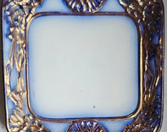 Beautiful antique Victorian Staffordshire flow blue plate with copper embossing.