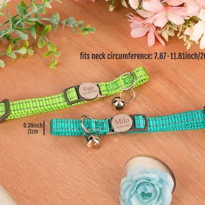May include: Two personalized pet collars, one lime green and one teal, with silver name tags and small bells. The collars fit neck circumferences of 7.87-11.81 inches. The width of the collar is 0.39 inches.