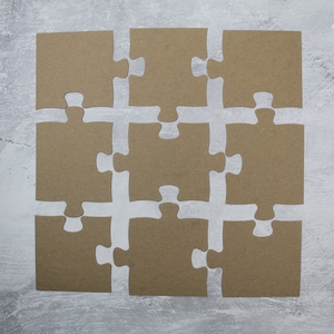 9 piece 12&quot; x 12&quot; jumbo jigsaw puzzle Bare chipboard die cuts @ piece approx. 4&quot;