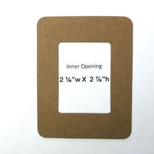 May include: A brown cardboard picture frame with a rectangular opening. The inner opening measures 2 1/8" wide by 2 7/8" high. The text "Inner Opening" is printed on the frame.