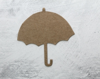 May include: A brown paper cutout of an umbrella on a white textured background.