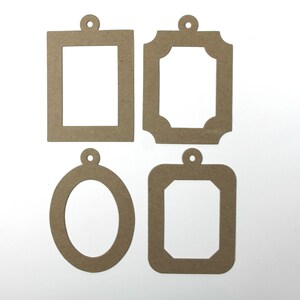 May include: Four brown cardboard picture frames with a hole at the top for hanging. The frames are different shapes and sizes.