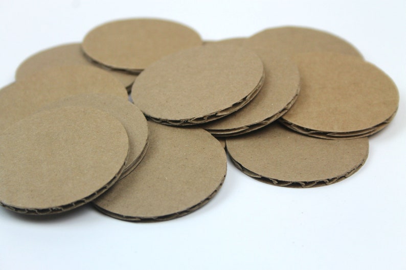 May include: A stack of brown cardboard circles, probably for crafting or DIY projects.