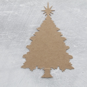 May include: A brown cardboard cutout of a Christmas tree with a star on top, against a light gray background.