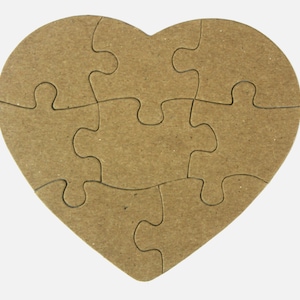 May include: A brown cardboard heart-shaped jigsaw puzzle with 8 interlocking pieces.