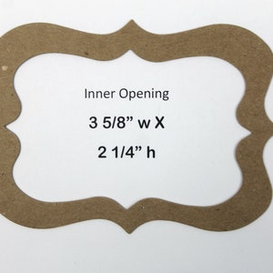 May include: A brown cardboard frame with a decorative, scalloped edge. The frame has an inner opening measuring 3 5/8" wide by 2 1/4" high. The text "Inner Opening" is printed above the measurements.