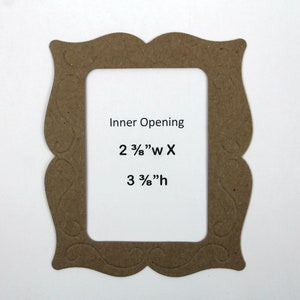 May include: A brown cardboard picture frame with an ornate design. The frame has an inner opening that measures 2 3/8" wide by 3 3/8" high.