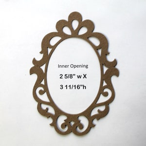 May include: A brown cardboard oval frame with a decorative, ornate design. The inner opening measures 2 5/8" wide by 3 11/16" high.