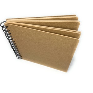 May include: A brown spiral bound notebook with a blank cover.