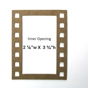 May include: A brown cardboard frame with a film strip border. The inner opening measures 2 1/8" wide by 3 3/4" high.  Inner Opening 2 1/8" w X 3 3/4" h