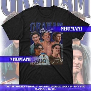 May include: Black t-shirt featuring a graphic of Graham Garrett with the text "GRAHAM Garrett" in blue. The shirt also includes the text "NHUMANI" in white. The bottom of the shirt has the text "WE USE REGULER T-SHIRT, IF YOU WANT OVERSIZE LOOKS UP TO 2 SIZE, EXAMPLE: L TO 2XL."