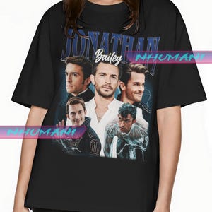 May include: Black t-shirt with a vintage-style graphic featuring a group of men with the text "Jonathan Bailey" above them.