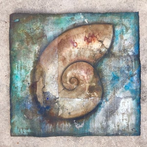 May include: A square canvas painting with a textured, abstract background in shades of blue, green, and brown. A large, fossilized ammonite shell is painted in the center of the canvas, with a spiral pattern in the center.