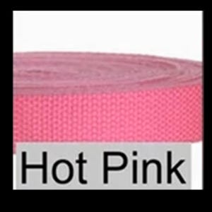 May include: A roll of hot pink woven webbing strap featuring a tight, durable texture. The material is coiled into a circular shape, displaying a consistent vibrant color throughout. A light gray rectangular label with the text Hot Pink is visible.