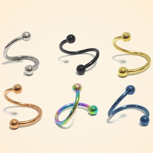 May include: Six different colored spiral earrings with ball ends. The earrings are made of metal and come in silver, black, gold, rose gold, rainbow, and blue.