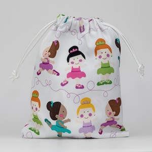 May include: White drawstring bag with a colorful print of ballerinas. The ballerinas are wearing pink, green, purple, and blue tutus. The bag has a white drawstring and is perfect for carrying small items.