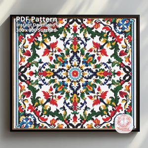 May include: A square cross stitch pattern featuring a symmetrical floral motif in red, green, yellow, and blue on a white background. The text reads PDF Pattern, Instant Download, 300 x 300 Stitches, and Najima Cross Stitch in the corner.