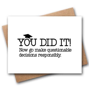 May include: A white rectangular greeting card with black text that reads YOU DID IT! with a small graduation cap icon above the text, followed by the phrase Now go make questionable decisions responsibly. The card is placed on a brown envelope.