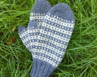 Hand knit wool mittens by Tidal yarns in hand dyed blue and white undyed alternative .