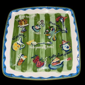 May include: Square ceramic serving platter with a green and white striped background. The platter features hand-painted illustrations of food and drinks, with phrases like "Ya'll are too cute!" and "Help yourself hon!" in a whimsical style.