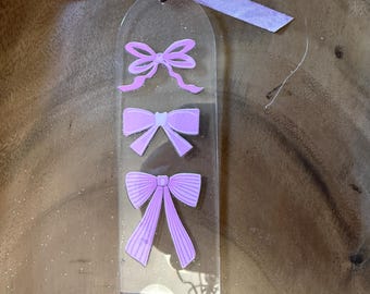 Acrylic bow bookmark with ribbon.