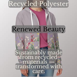 May include: A light gray zip-up hoodie with a floral pattern and the text "Recycled Polyester", "Renewed Beauty", and "Sustainably made from recycled materials - transformed with care."