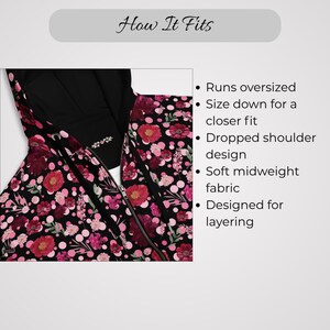 May include: A black zip-up hoodie with a floral pattern in shades of red, pink, and white. The hoodie has a hood and a zipper closure. The text "How It Fits" is at the top, with bullet points describing the fit and fabric.