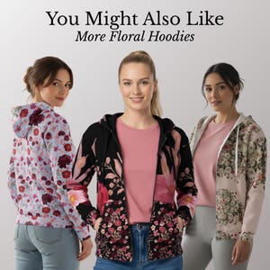 May include: Three women wearing floral hoodies. The hoodies feature various floral patterns in shades of pink, red, and white on a black, light blue, and beige background. The text "You Might Also Like More Floral Hoodies" is at the top.
