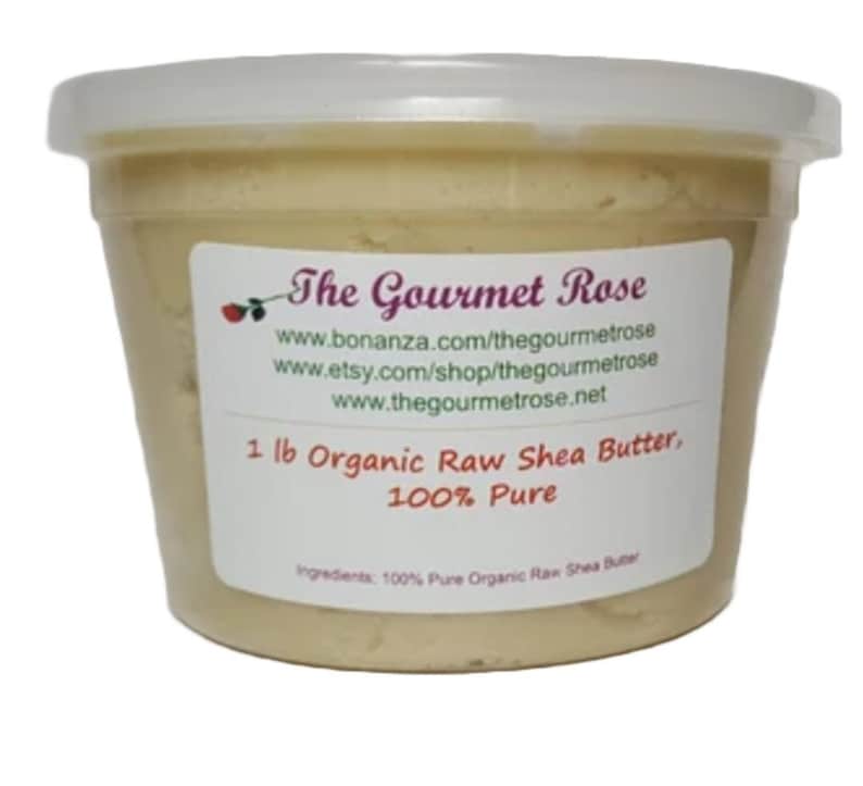 May include: A plastic container filled with light yellow shea butter. The container has a white lid and a label with the text "The Gourmet Rose" and product information, including "1 lb Organic Raw Shea Butter, 100% Pure."