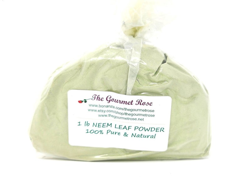 May include: A clear plastic bag filled with light green neem leaf powder. A white label displays the text "1 lb NEEM LEAF POWDER 100% Pure & Natural" and the brand name "The Gourmet Rose".