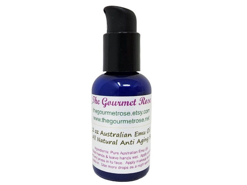 May include: A dark blue 2 oz bottle of Australian Emu Oil with a black pump dispenser. The bottle has white text that reads "The Gourmet Rose" and "All Natural Anti Aging".