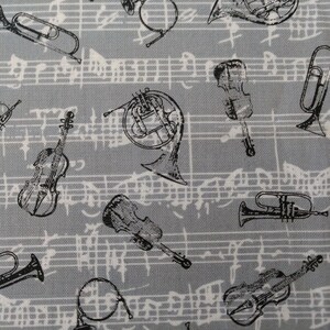 Music notes instruments sheet music on gray quilt fabric by the half yard