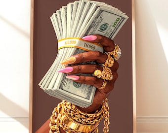 May include: A framed print featuring a hand holding a large stack of $100 bills, secured with a yellow band. The hand is adorned with gold rings, bracelets, and long, colorful nails. The background is a solid brown.