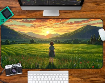 May include: A rectangular desk mat featuring an anime-style illustration of a person standing in a vast green field at sunset, with rolling mountains in the distance, a bright orange sky, and scattered red wildflowers in the foreground.