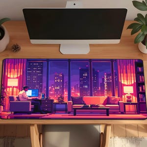 May include: A rectangular pixel art mousepad featuring a cityscape at night. The design includes a person working on a computer, a sofa, and a view of city buildings with purple and orange hues. The mousepad is on a wooden desk.