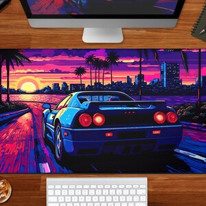 May include: A blue sports car drives down a road with a sunset in the background. The road is lined with palm trees and the city skyline is visible in the distance.