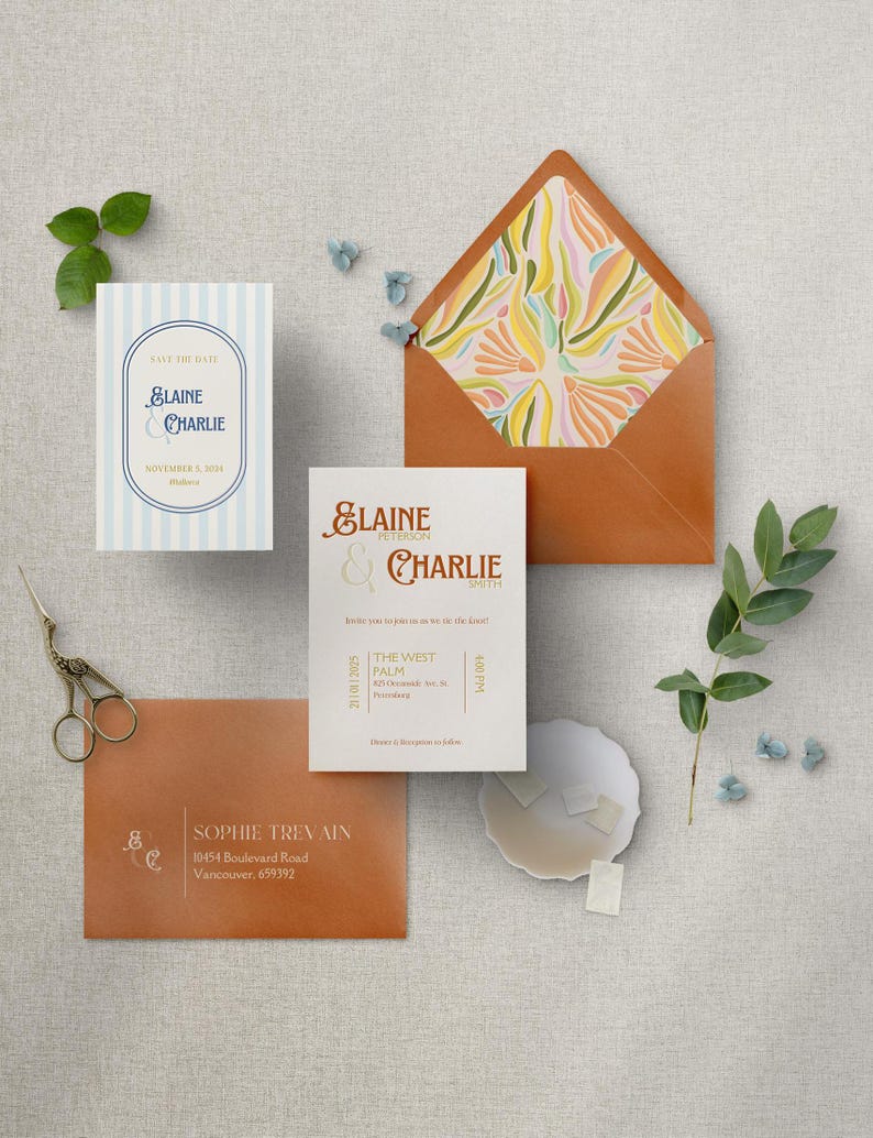 May include: A wedding invitation suite with a light blue and white striped save the date card, a white invitation card with gold text, and a brown envelope with a colorful floral pattern. The invitation card reads "Elaine & Charlie" and includes the date and time of the wedding, as well as the location: "The West Palm, 821 Orangewood Ave. #10, Pasadena". The envelope has a return address label that reads "Sophie Trevain, 10454 Boulevard Road, Vancouver, 659392".