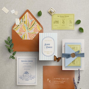 May include: Wedding invitation suite with a save the date card, rehearsal dinner invitation, and wedding weekend schedule card. The cards are decorated with a blue and white striped pattern, a floral design, and a butterfly.