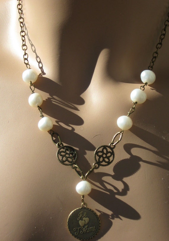 Items similar to Pearl and Antique Brass Necklace With Je t'aime (I