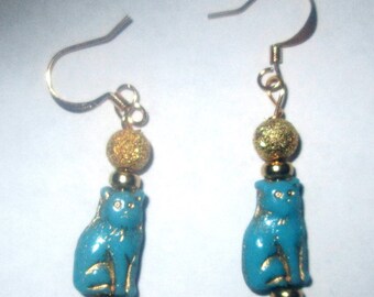 Turquoise Colored Sitting Cat Earrings With Gold Accents